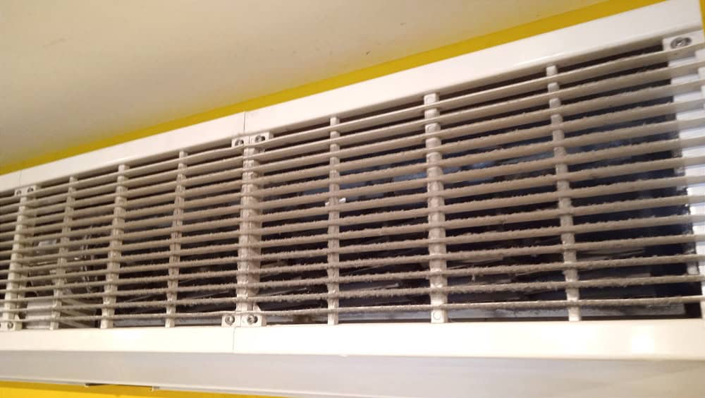 How often should vent covers and return grilles be cleaned
